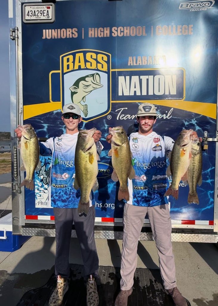 two college anglers holding their winning fish